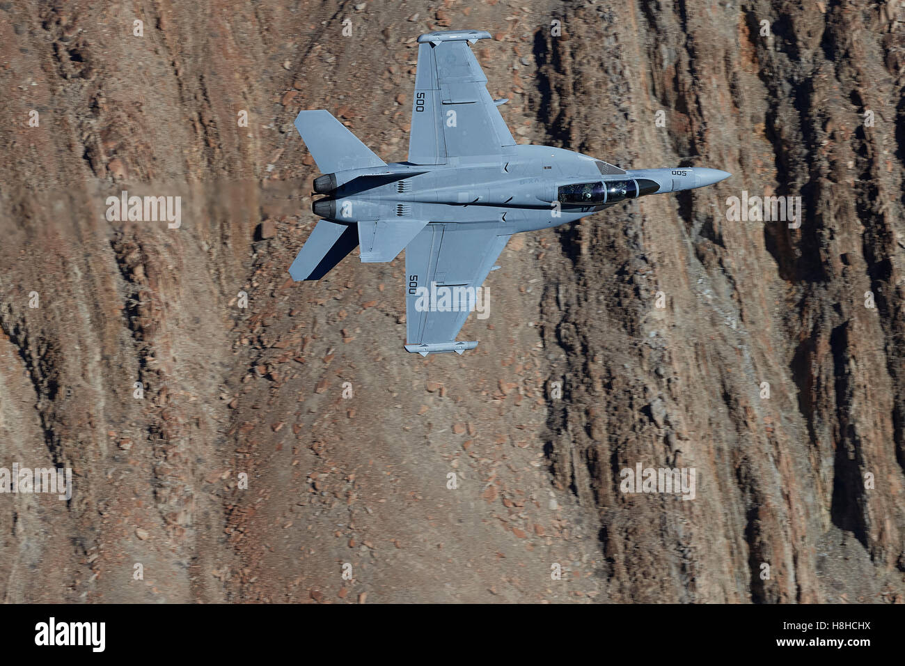 US Navy EA-18G, Growler, Flying Through Rainbow Canyon, California. Stock Photo
