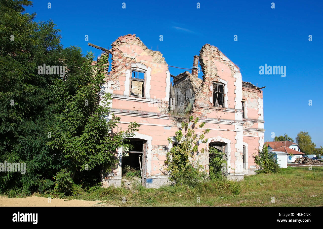 Abandoned house riddled with bullet holes during the Siege of Vukovar, on the shore of the River Danube in Slavonia, Croatia. Stock Photo