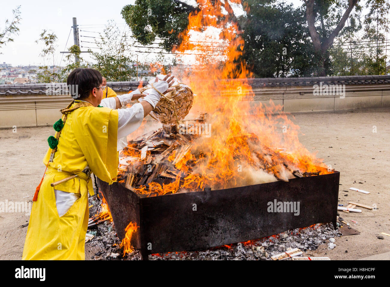 Japan, Nishinomiya, Mondo Yakujin Temple. Yamabushi priest in yellow ...