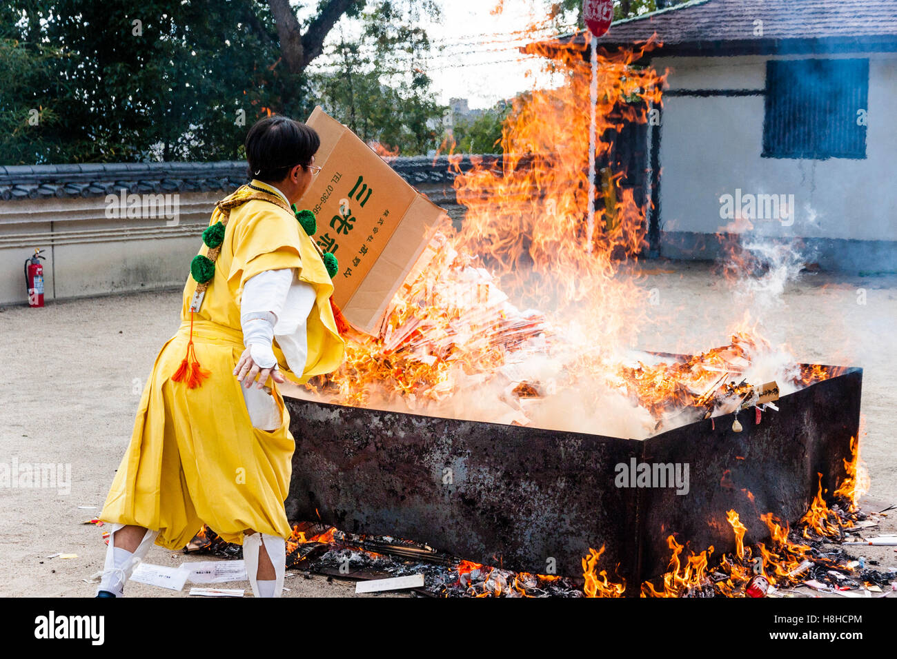 Japan, Nishinomiya, Mondo Yakujin Temple. Yamabushi priest in yellow ...