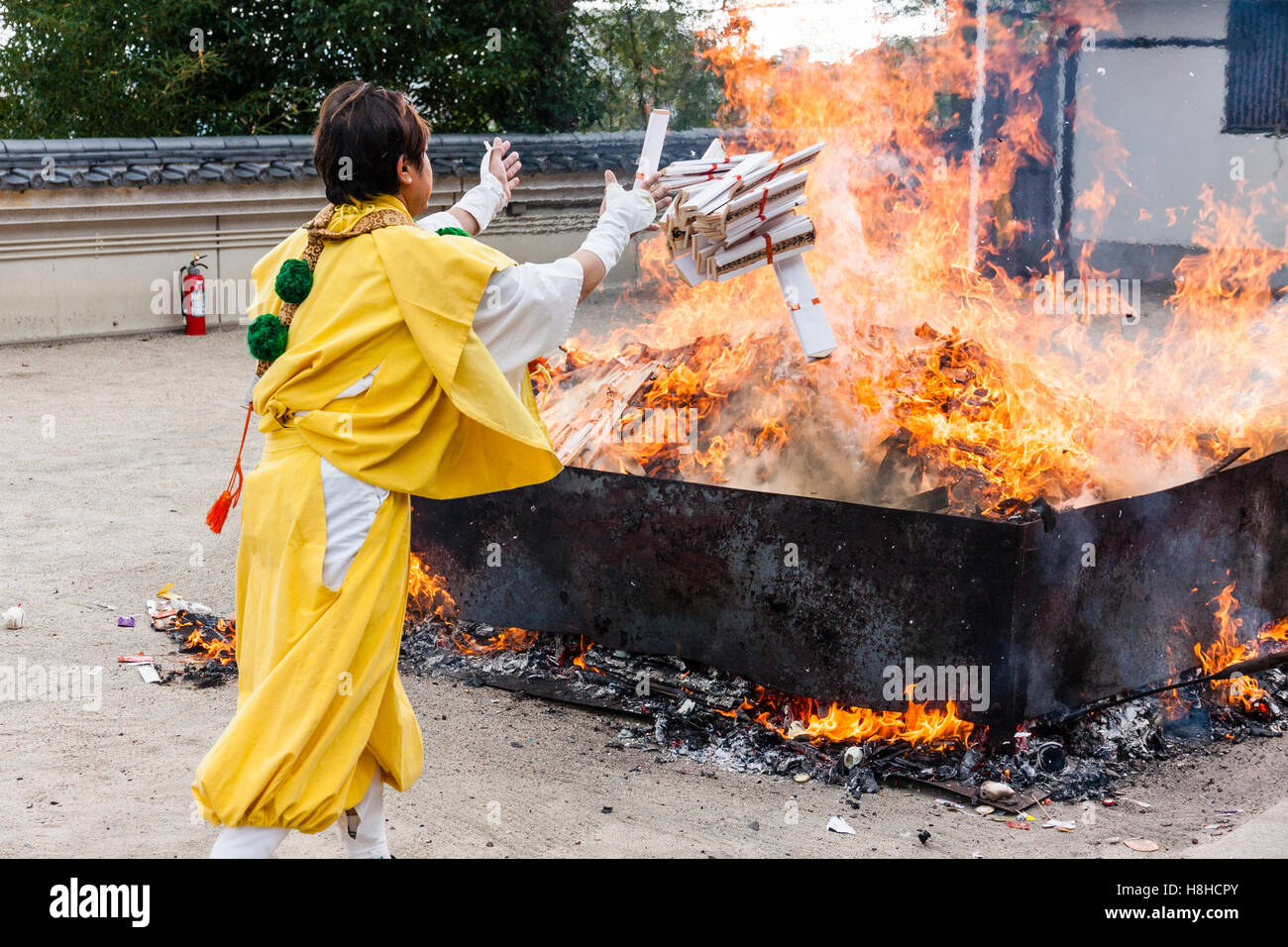 Japan, Nishinomiya, Mondo Yakujin Temple. Yamabushi priest in yellow ...