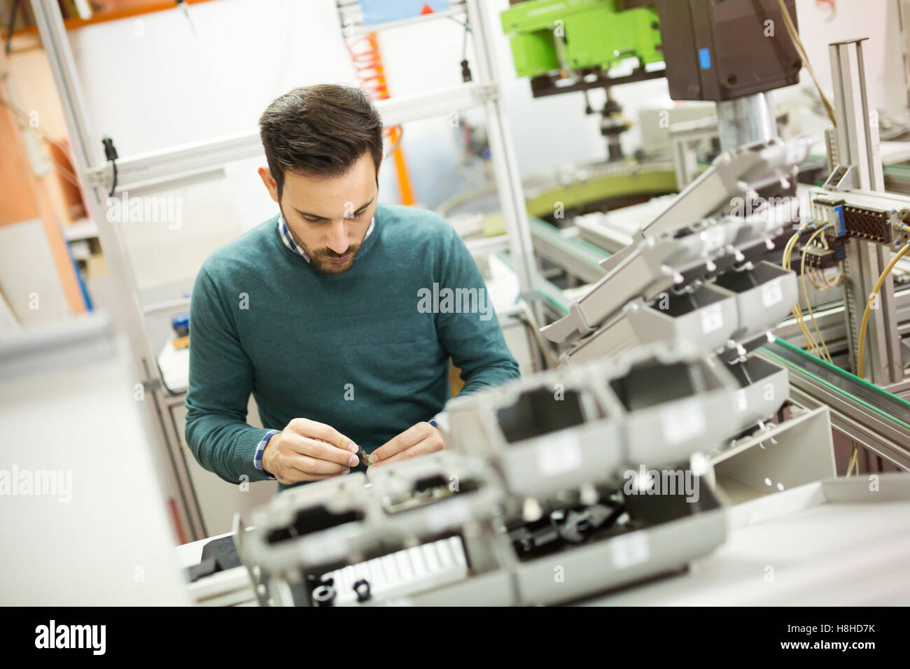 Creative mechanical engineer working on machines Stock Photo Alamy