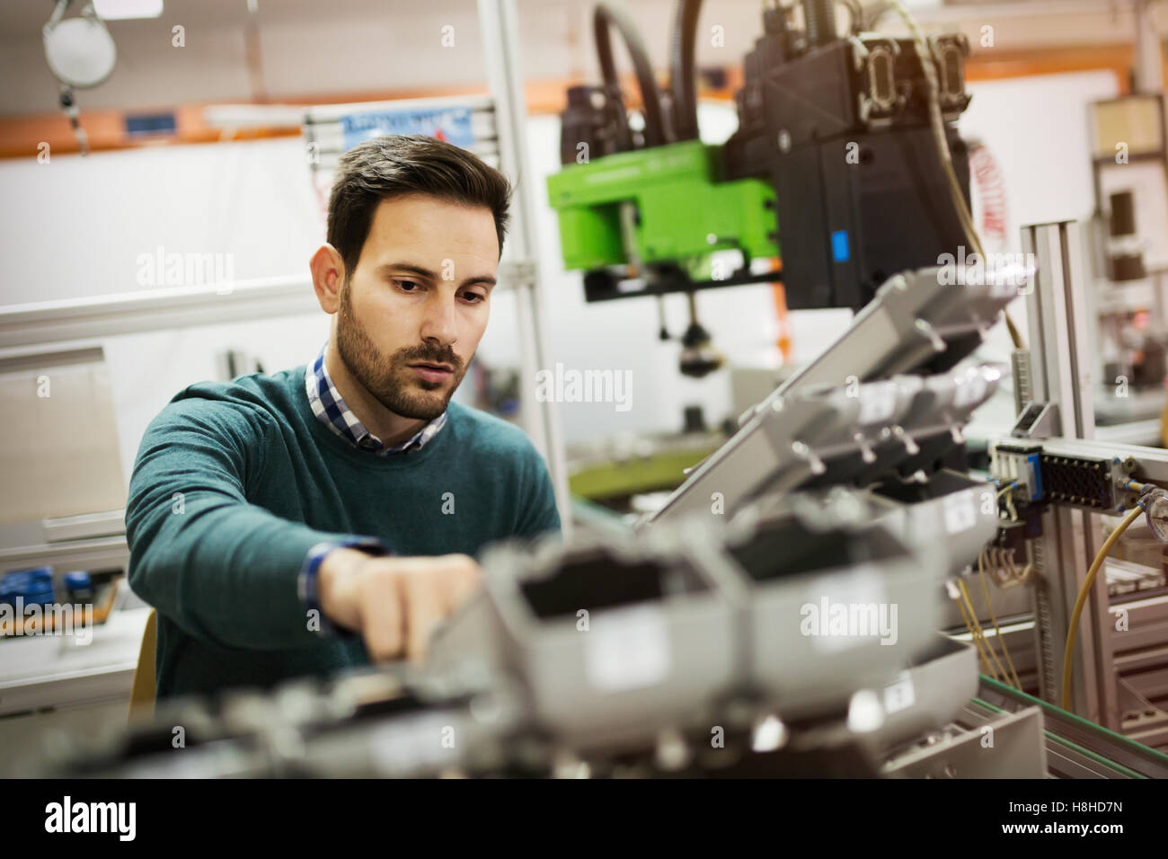Creative mechanical engineer working on machines Stock Photo Alamy