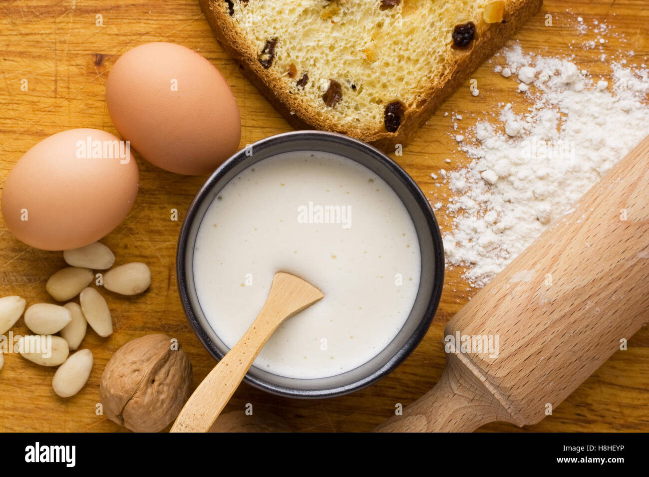 Creme anglaise custard with eggs, almonds and walnut. Stock Photo