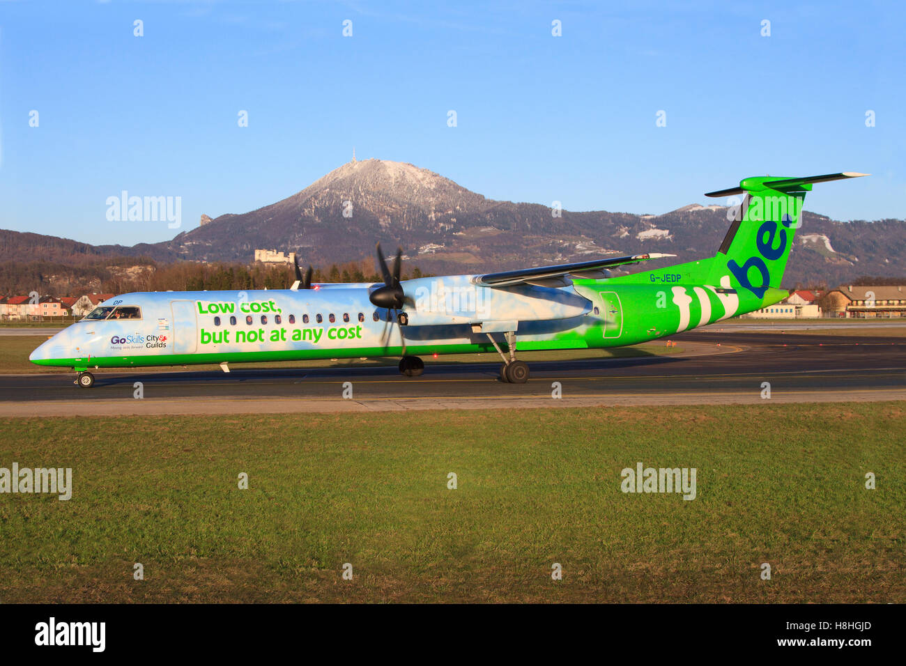 Salzburg/Austria August 9, 2016: Flybe Dash 8 from Austrian landing at Salzburg Airport. Stock Photo