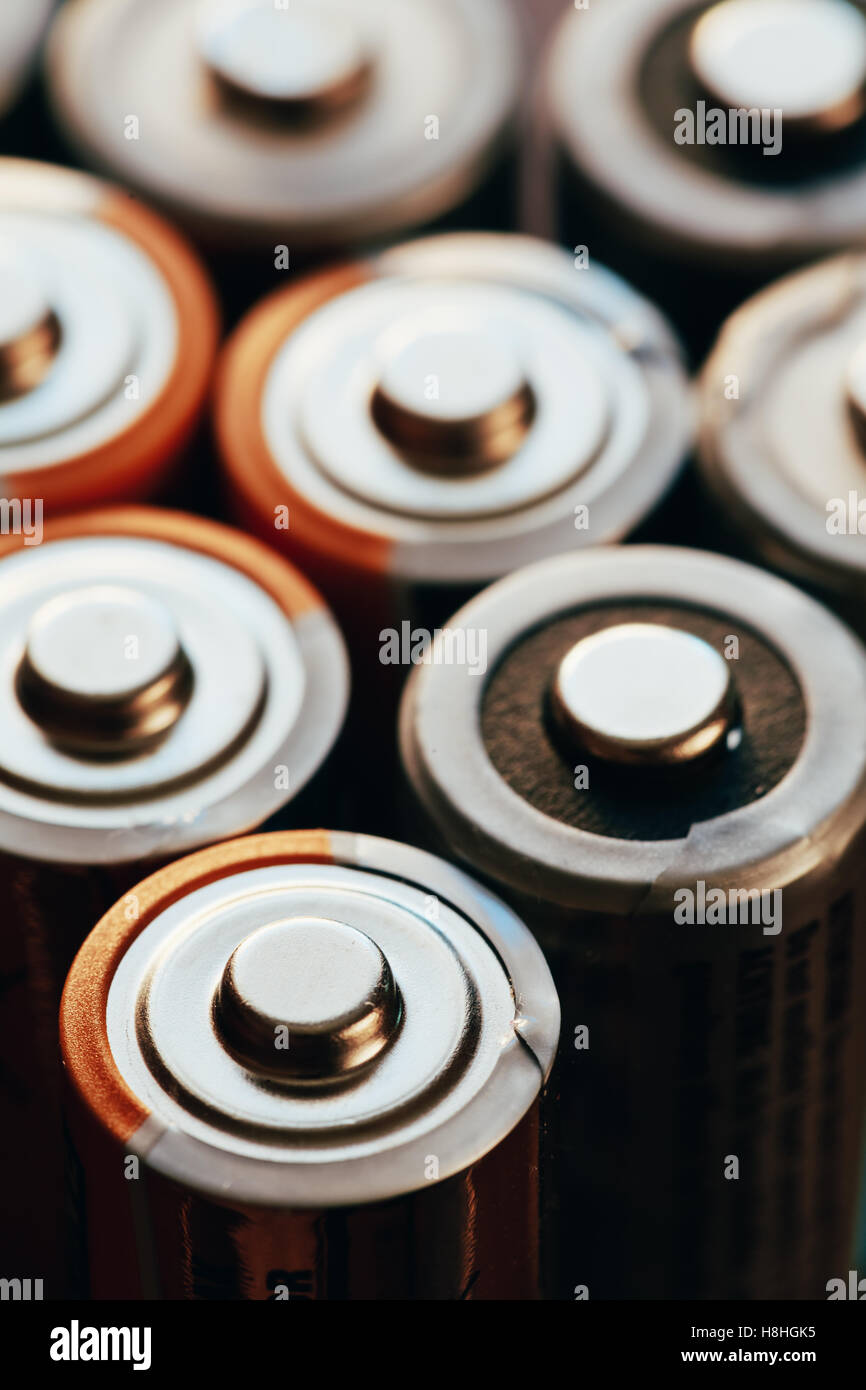 Several AA batteries closeup view background Stock Photo