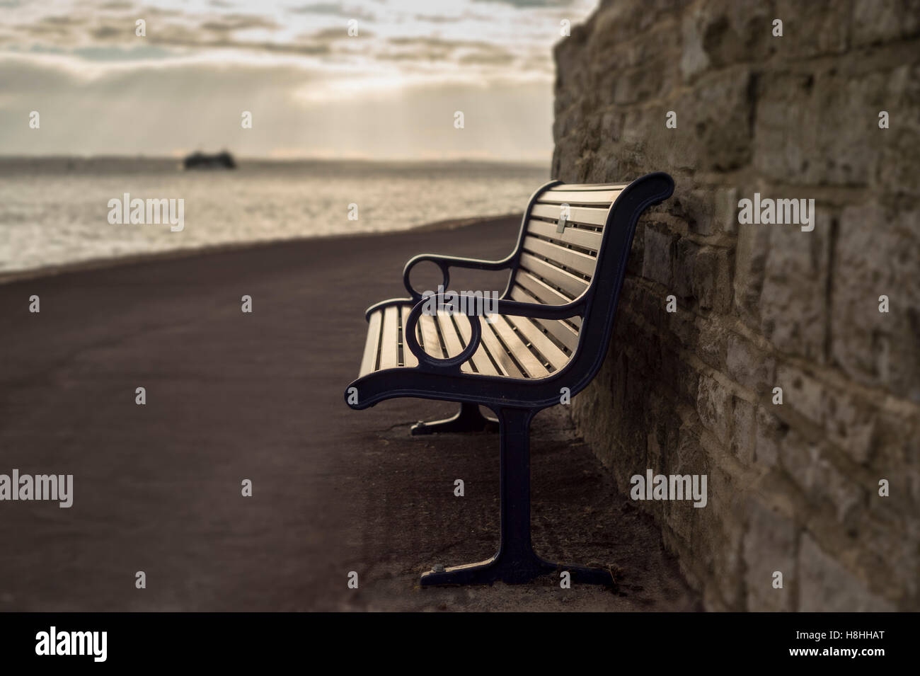 empty bench with coastal view Stock Photo