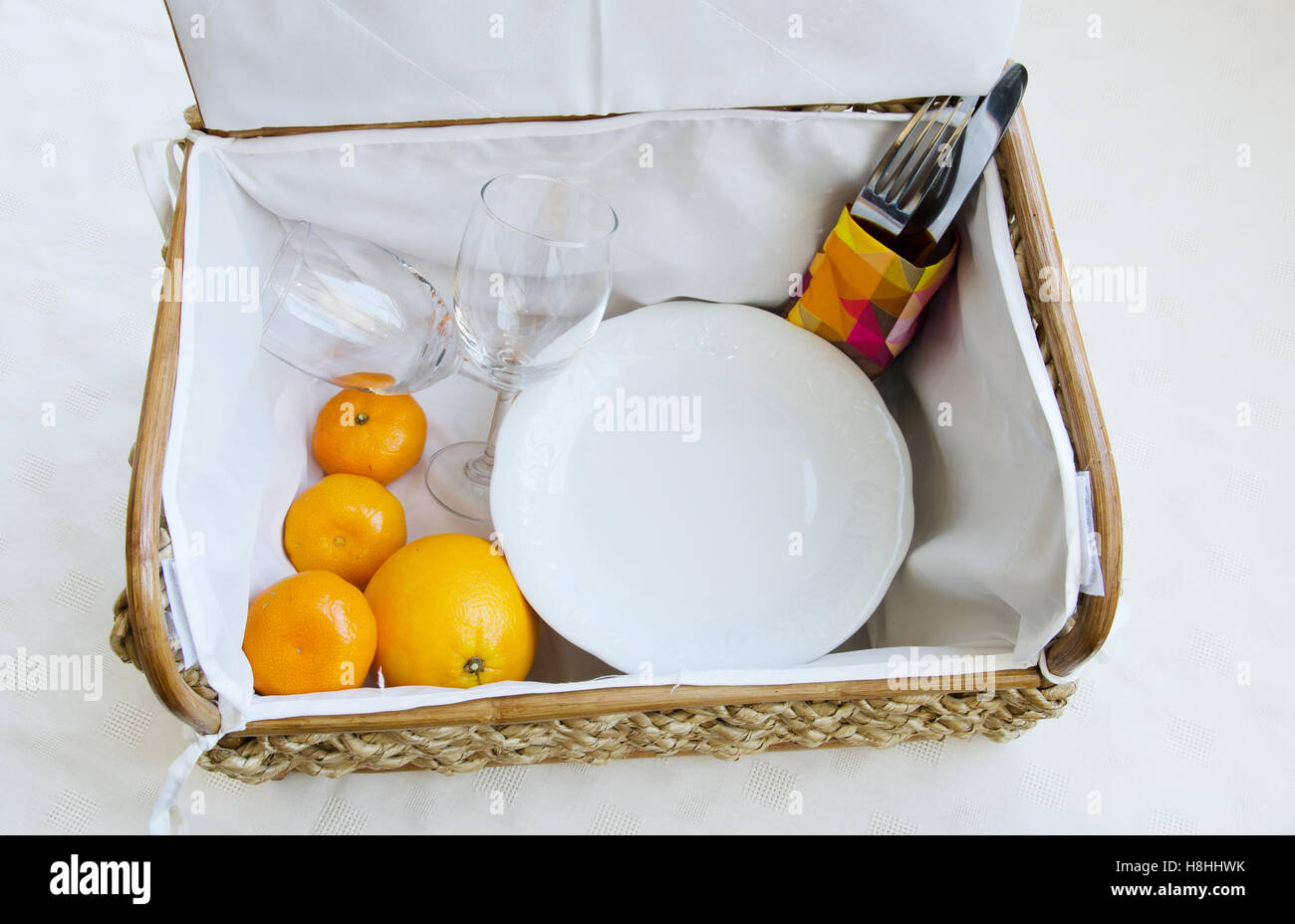 Picnic basket with wine glasses, fruit and food Stock Photo Alamy