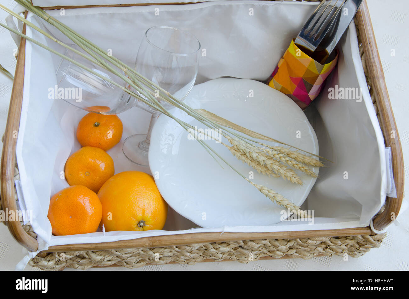 Picnic basket with wine glasses, fruit and food Stock Photo - Alamy