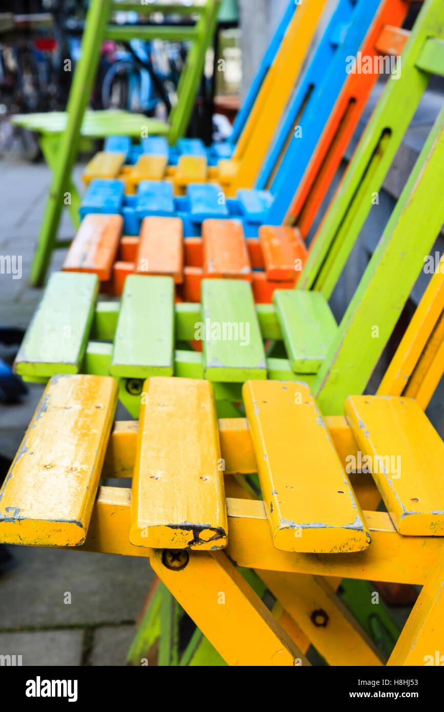 Brightly coloured chairs outside a cafe Stock Photo