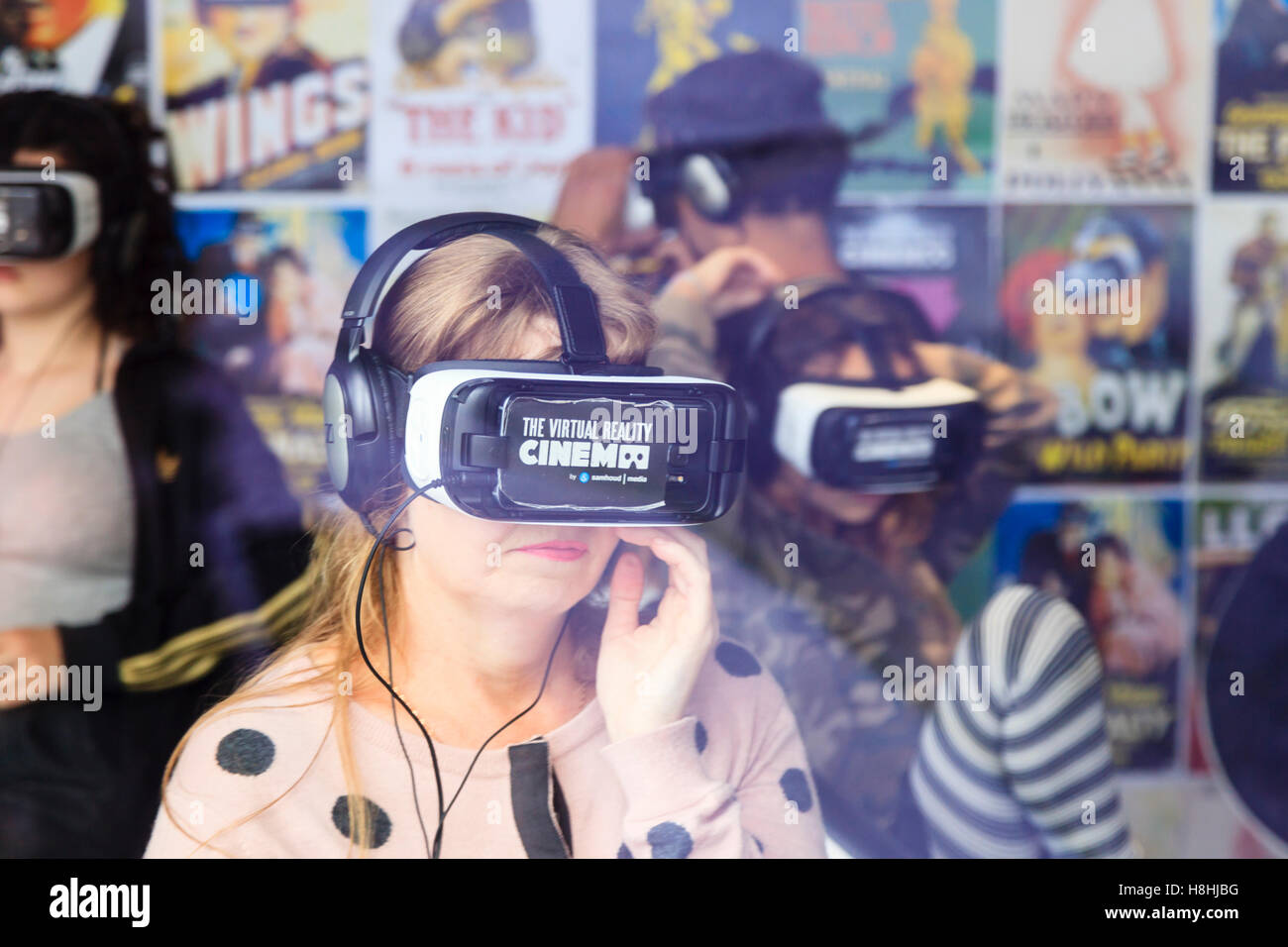 People wearing Virtual Reality head sets in The Virtual Reality Cinema Amsterdam, Netherlands Stock Photo