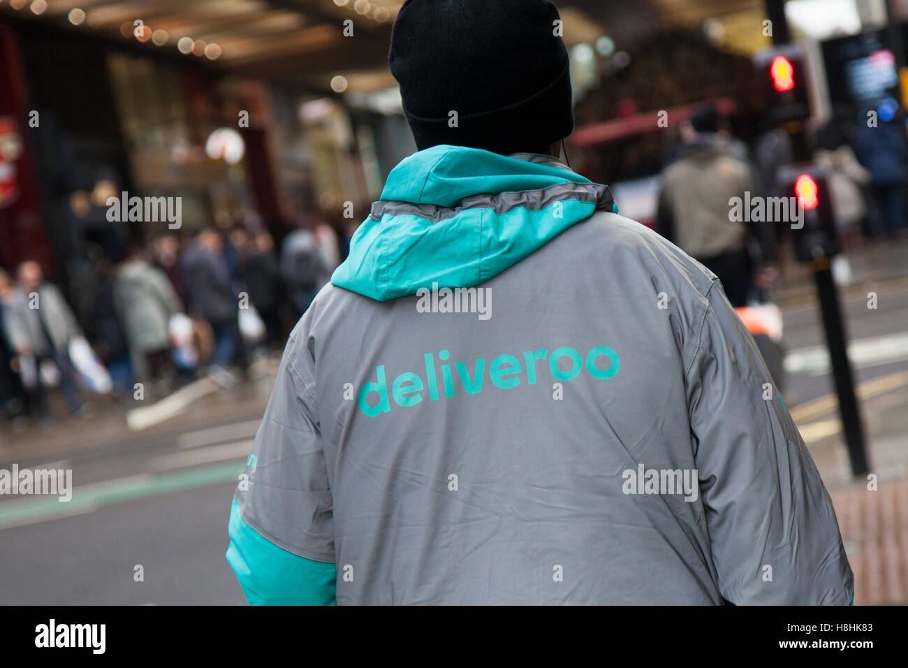 Deliveroo personnel in the Central Business District of Market Street, Manchester, UK Stock Photo