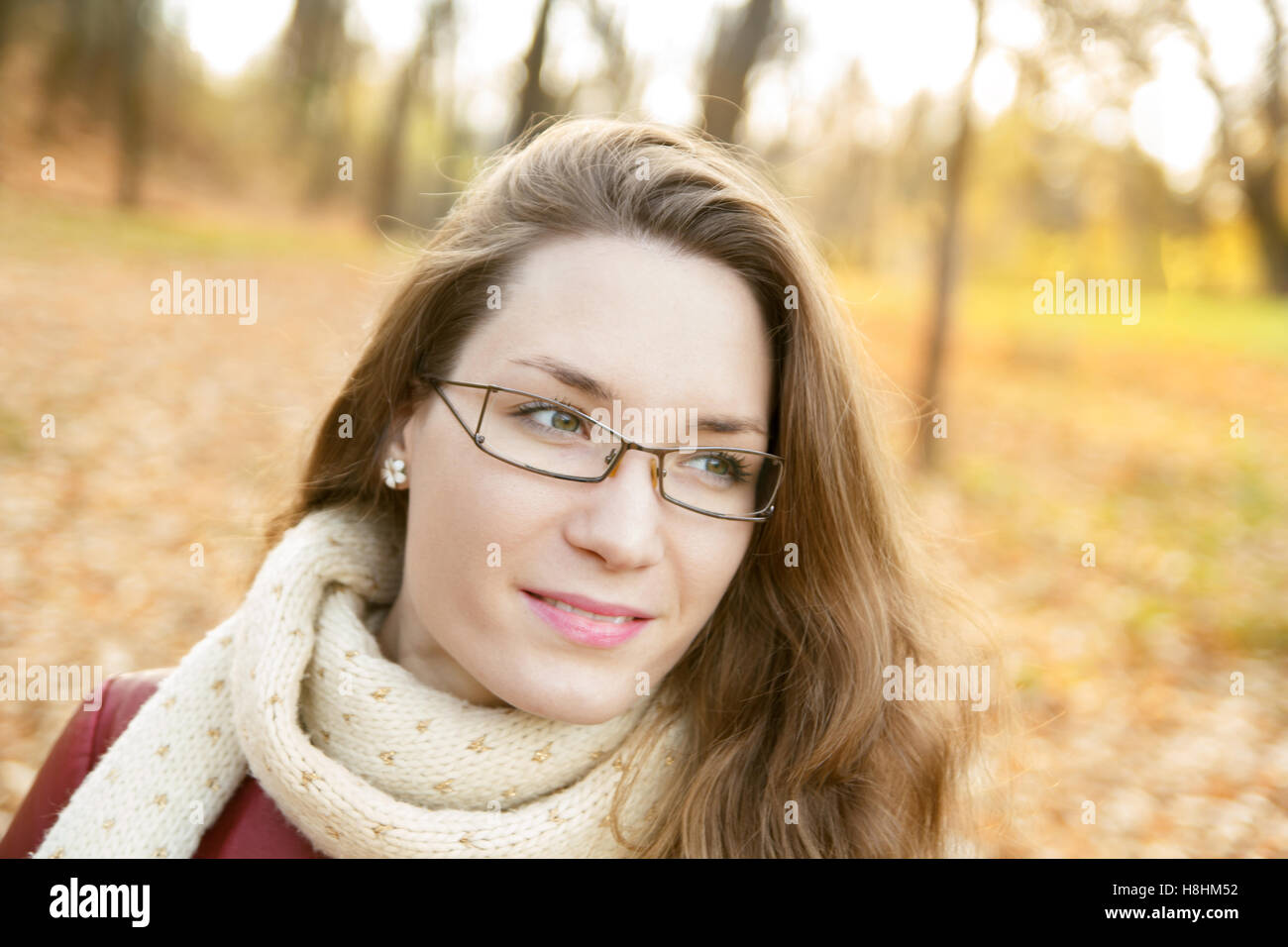Beautiful young woman outdoor portrait in autumn park Stock Photo - Alamy