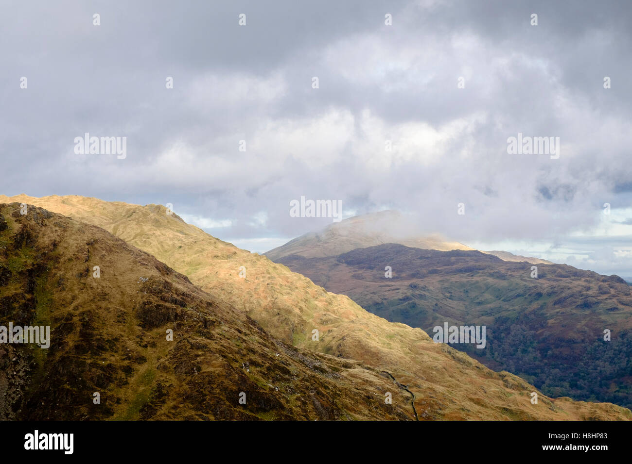 View across Gallt y Wenallt to distant Carnedd Moel Siabod peak in low cloud in mountains of Snowdonia National Park. Wales UK Stock Photo