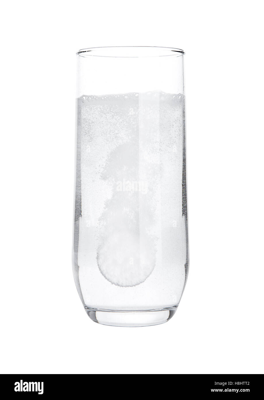 Pill dissolving in glass of water on white background isolated Stock