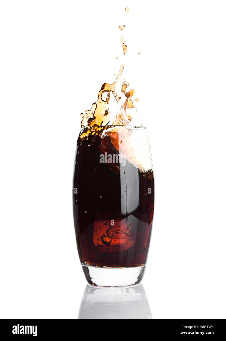 Glass of cola with splash and ice cubes on white background Stock Photo ...