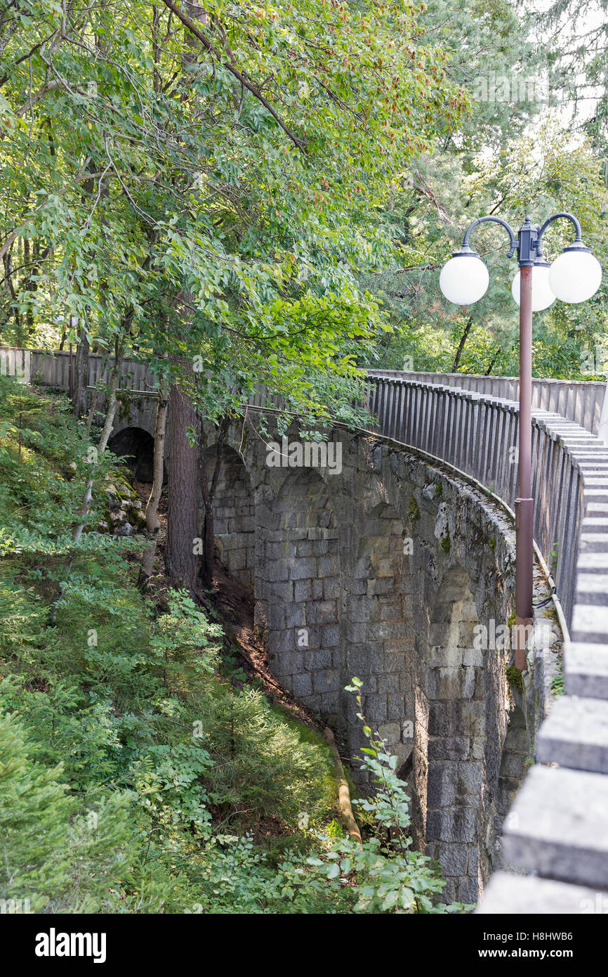Stone bridge to cafe Belvedere upper terrace, Villa Bled Resort, Slovenia. It is former summer tea house of Marshal Tito, Presid Stock Photo