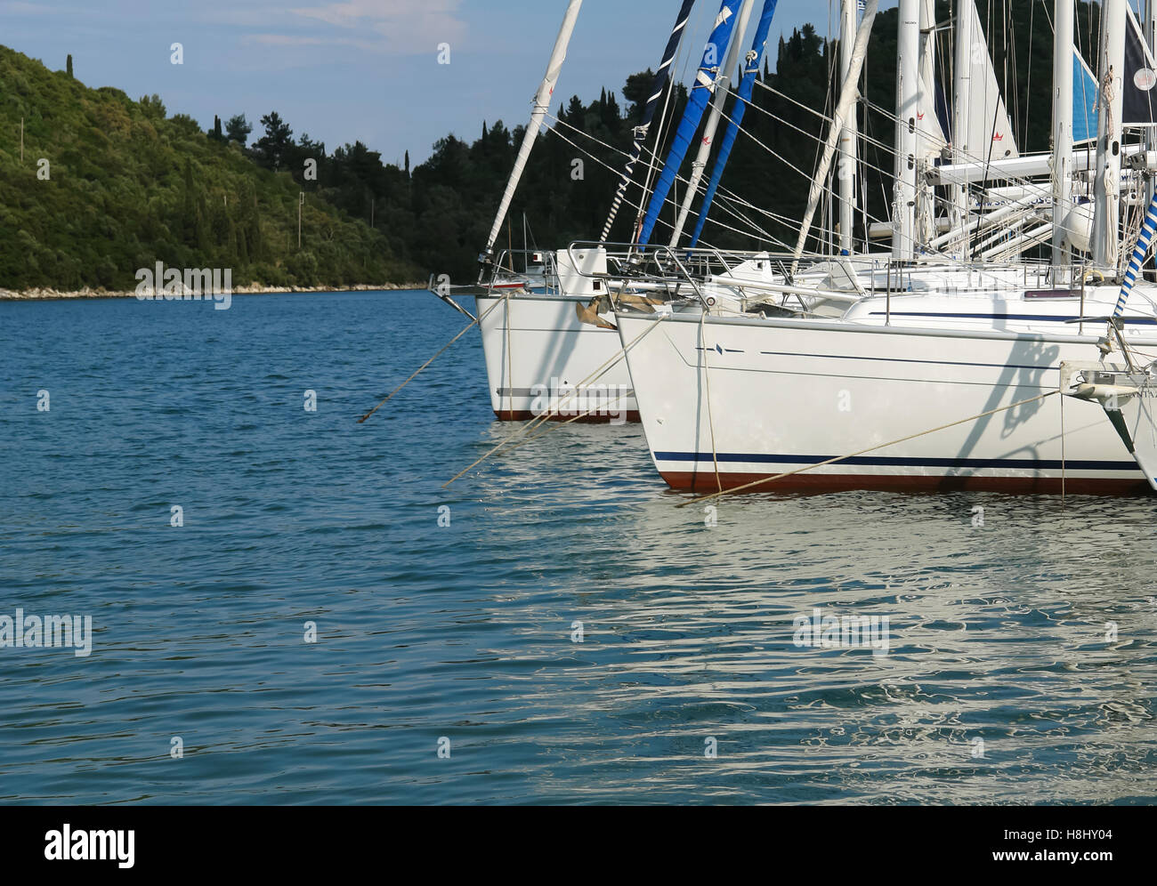 Nidri, GREECE, May 11, 2013 The white yachts in blue harbour in Ionian