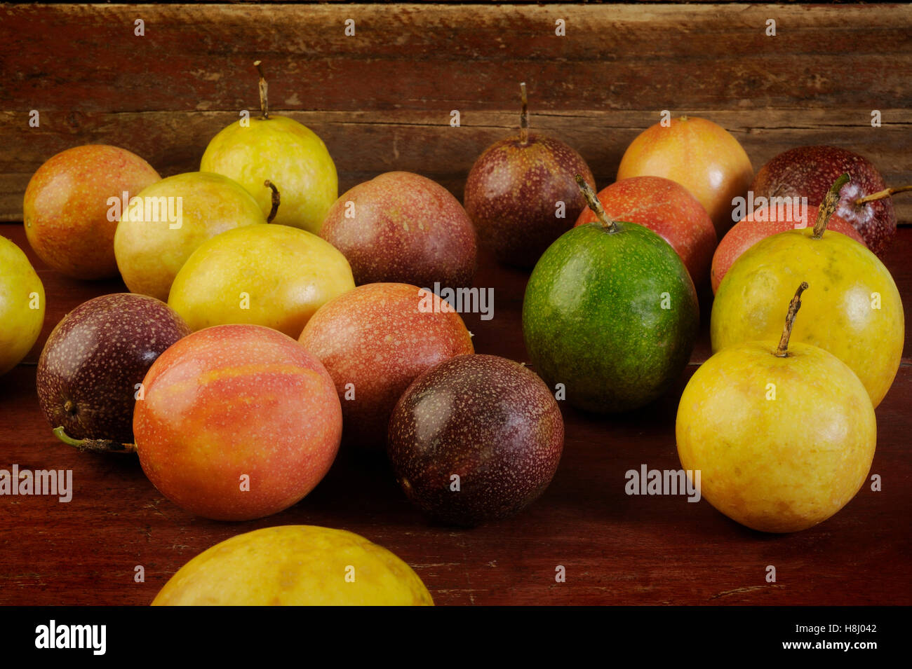 Passion fruits on wooden background Stock Photo