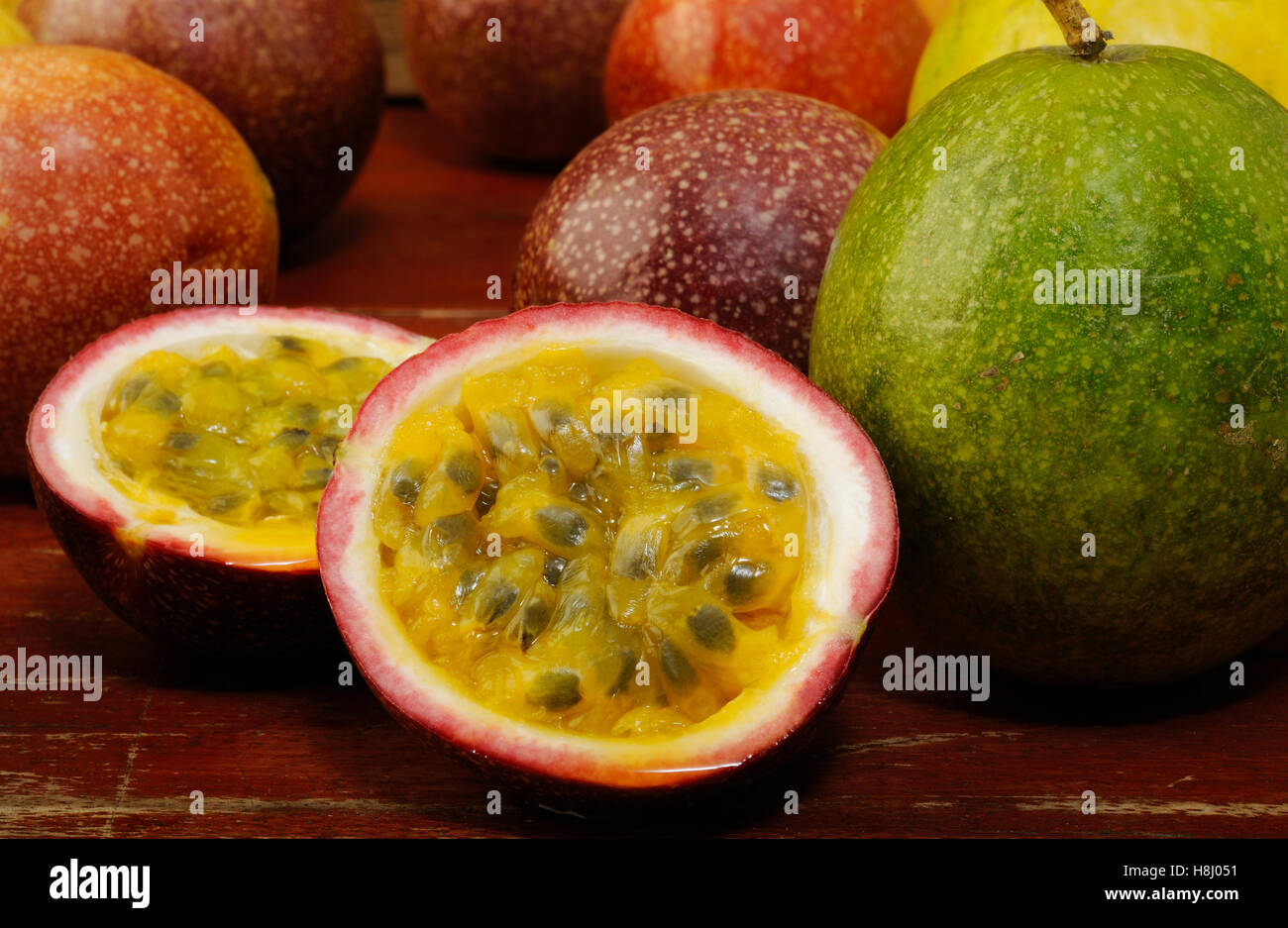 Passion fruits on wooden background Stock Photo