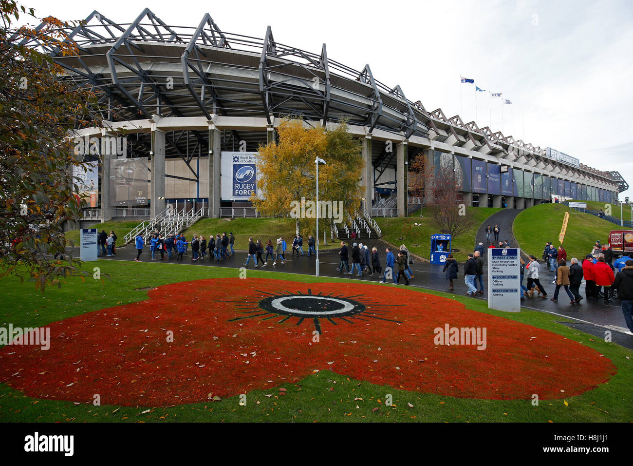 A poppy marked on the grass outside the BT Murrayfield Stadium, Edinburgh. Stock Photo