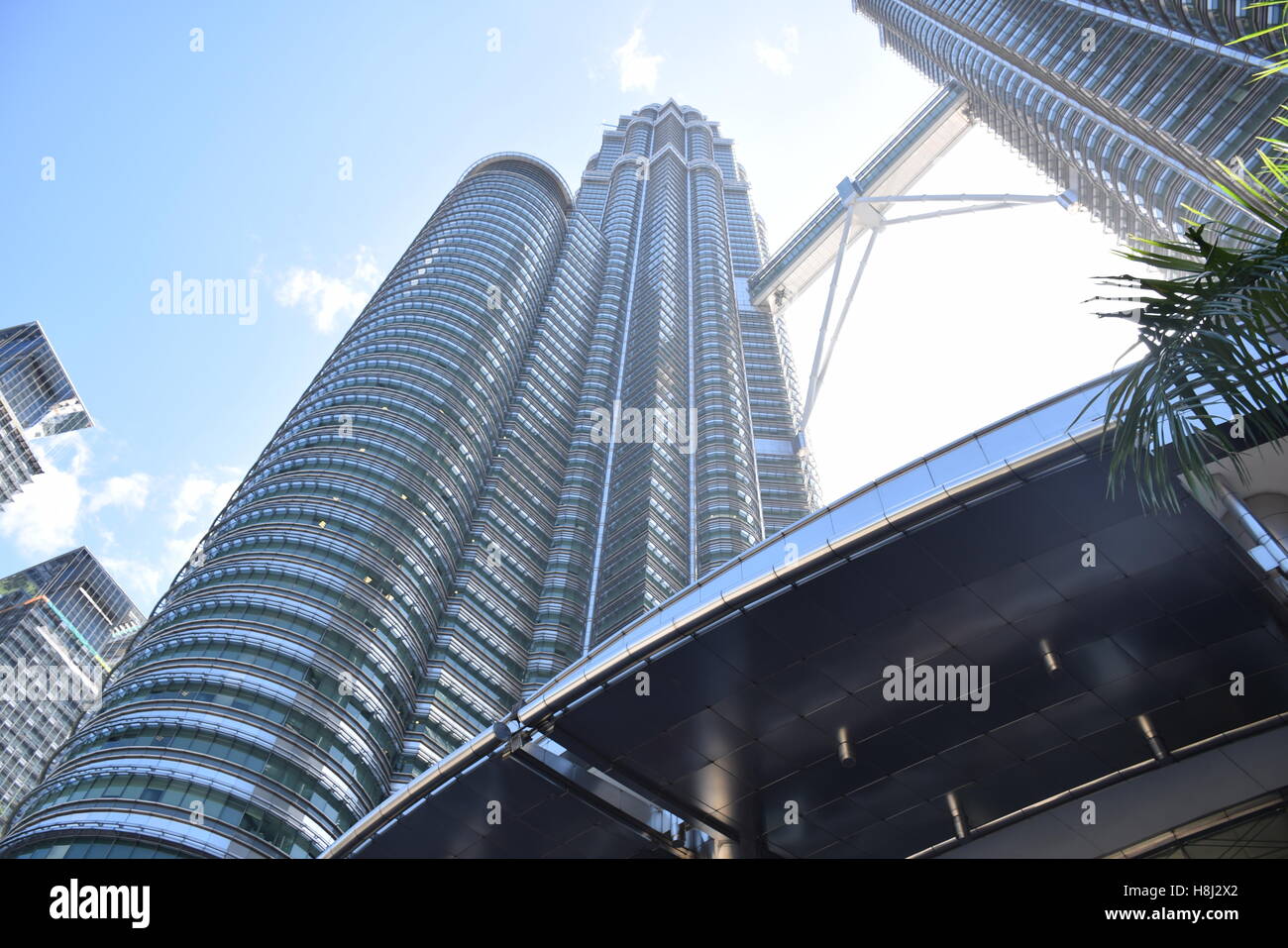 View of the Petronas twin towers and the entrance canopy in Kuala Lumpur, Malaysia Stock Photo