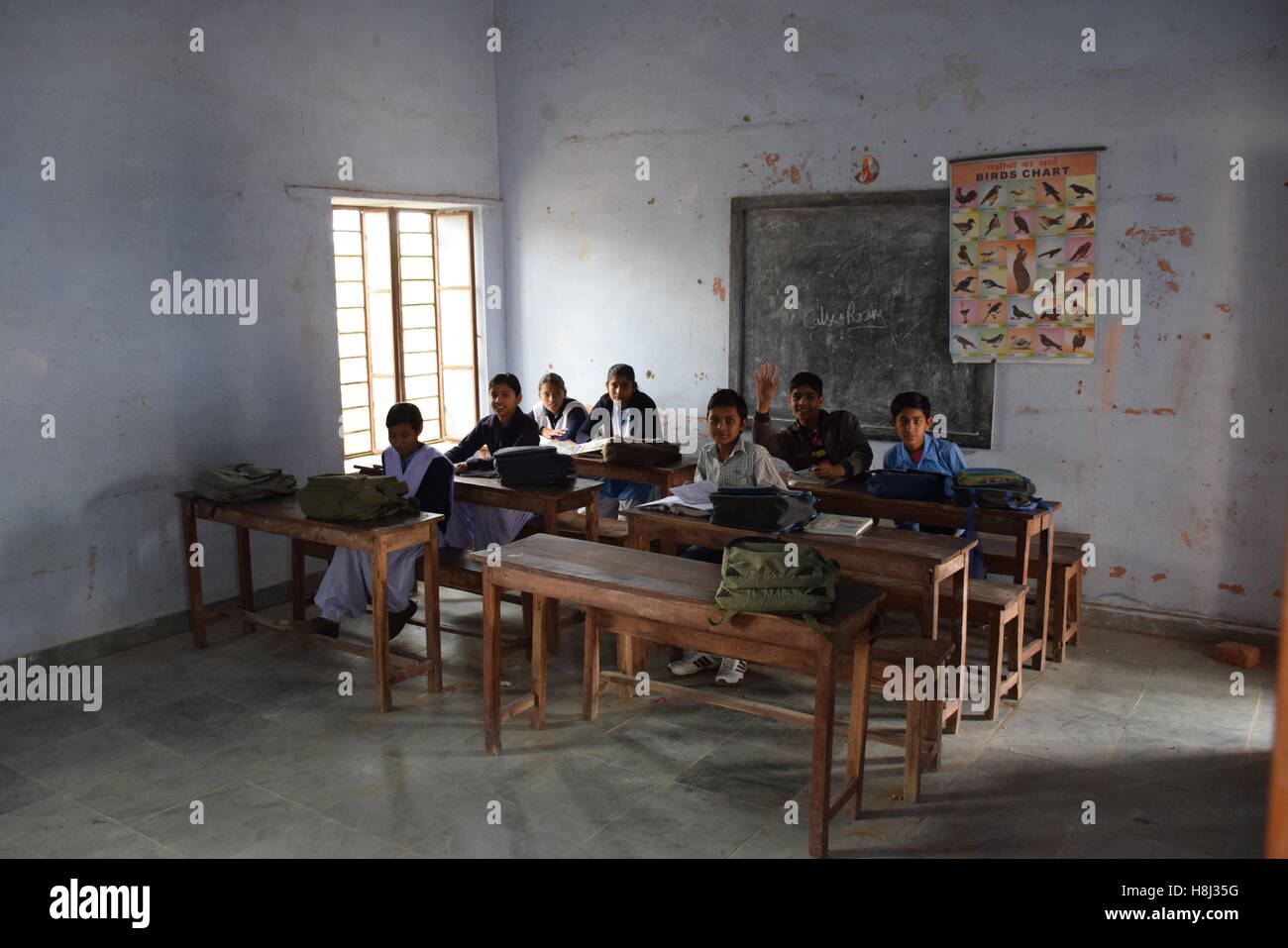 Indian kids in their classroom in a poor village school in Rajasthan, India Stock Photo