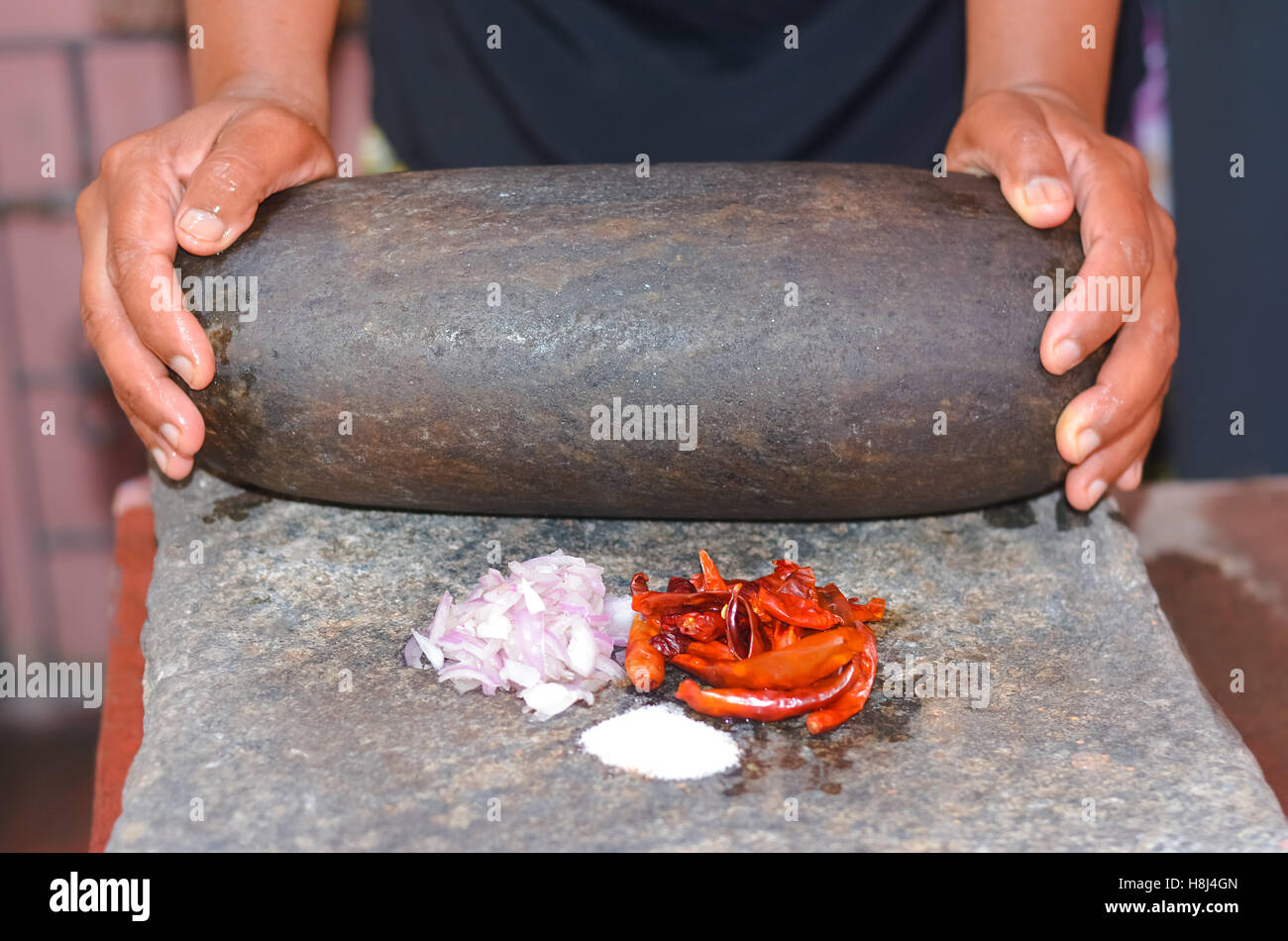 Traditional Sri Lankan way of grinding spices with the grinding stone