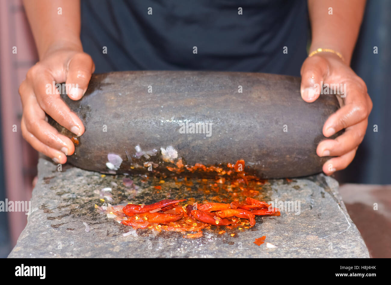 Traditional Sri Lankan way of grinding spices with the grinding stone Stock Photo Alamy