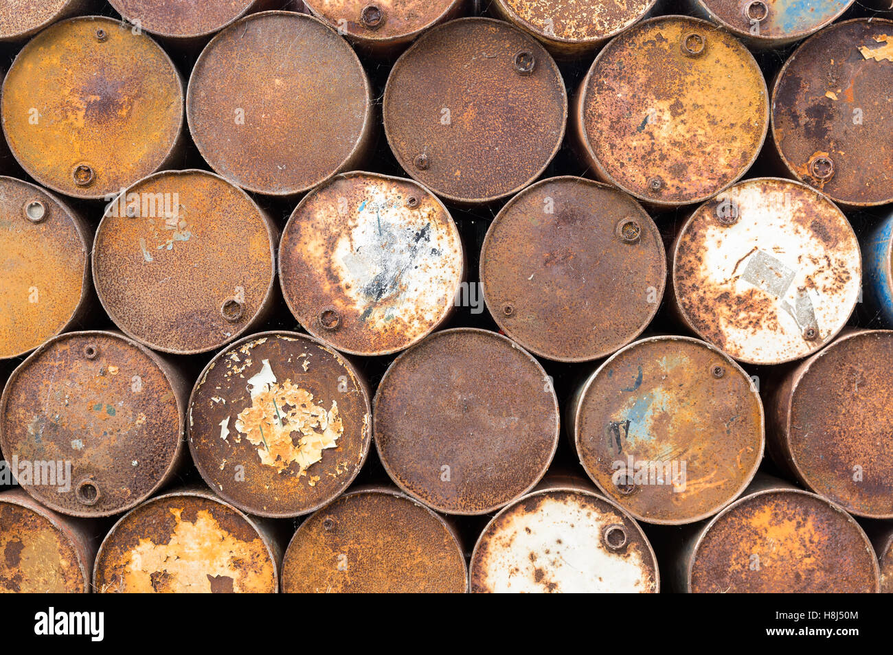 Brown background of old rusty oil barrels Stock Photo