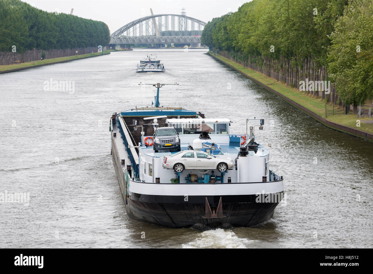 Big barge navigating at Dutch canal near Amsterdam Stock Photo