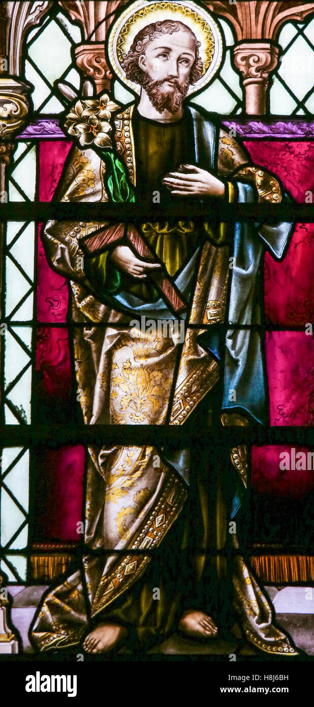 Stained Glass window depicting Saint Joseph, in the Cathedral of Saint Rumbold in Mechelen, Belgium. Stock Photo