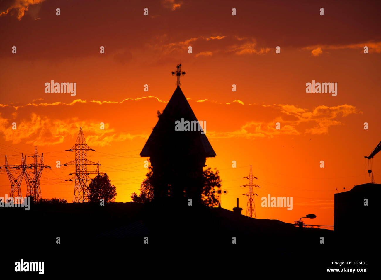 Sunset over the town with church tower, Tulcea, Romania. Stock Photo