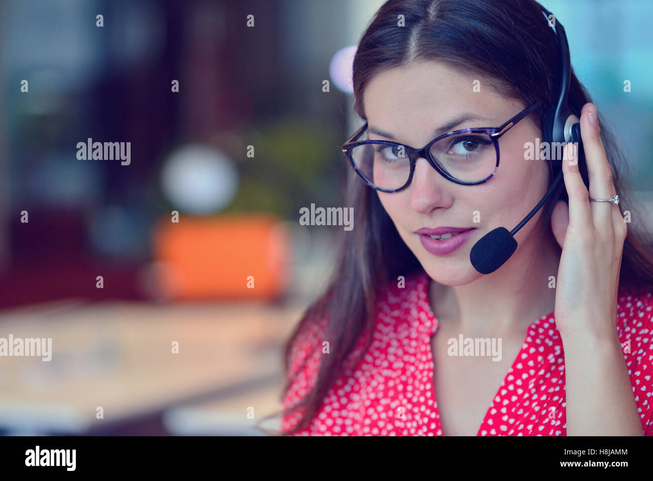 Young woman working in call centre Stock Photo