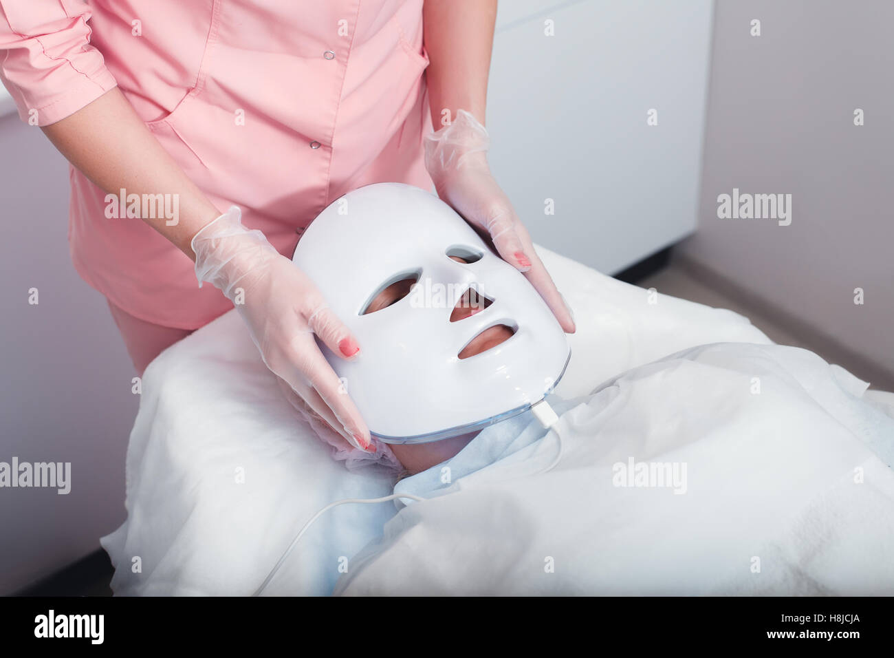 Photodynamic face mask therapy Stock Photo