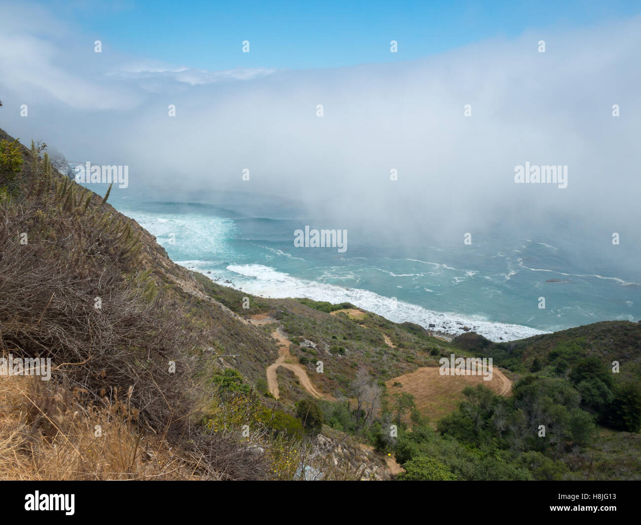 Clouds over the Pacific Ocean  at the end of Partington Cove Trail, Big Sur Stock Photo
