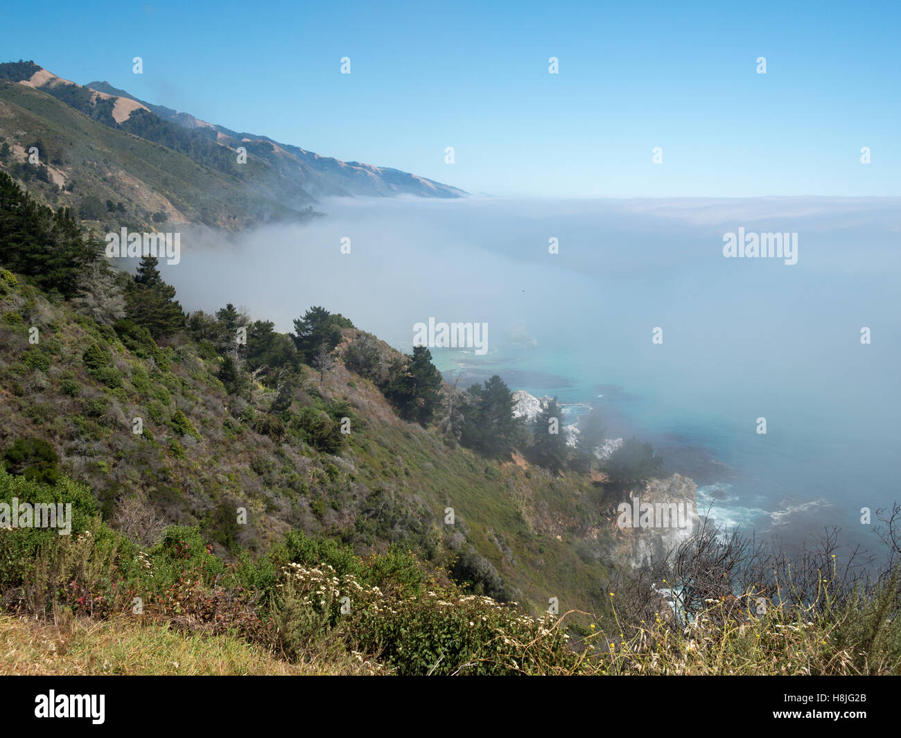 Low clouds over the Pacific Ocean in Big Sur Stock Photo