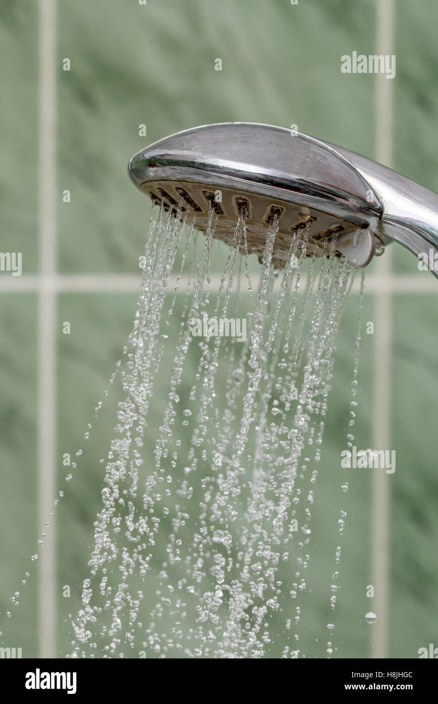 Closeup of shower head with flowing water splashing out, drops Stock ...