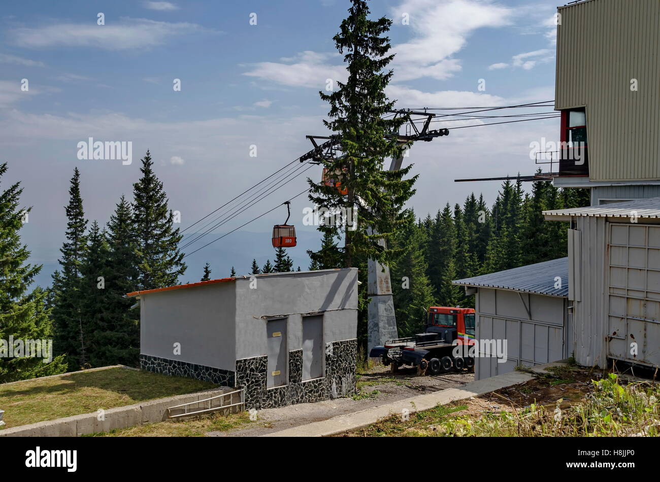 Station  of  contemporary ski tow or lift  with blue sky  near by hija or rest-house Aleko, Cherni vrah or Black  peak Stock Photo