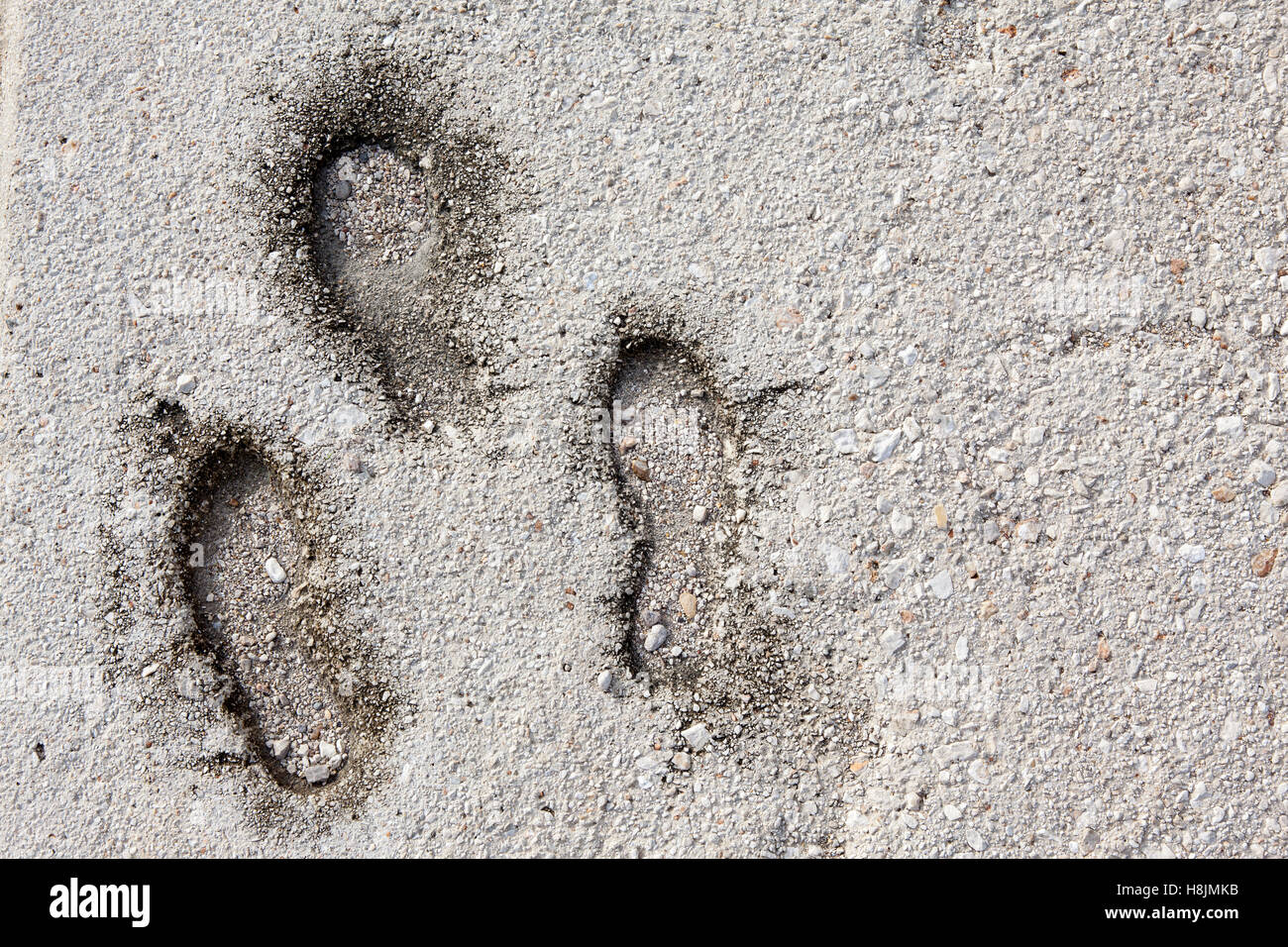 Foot print on grunge concrete texture Stock Photo