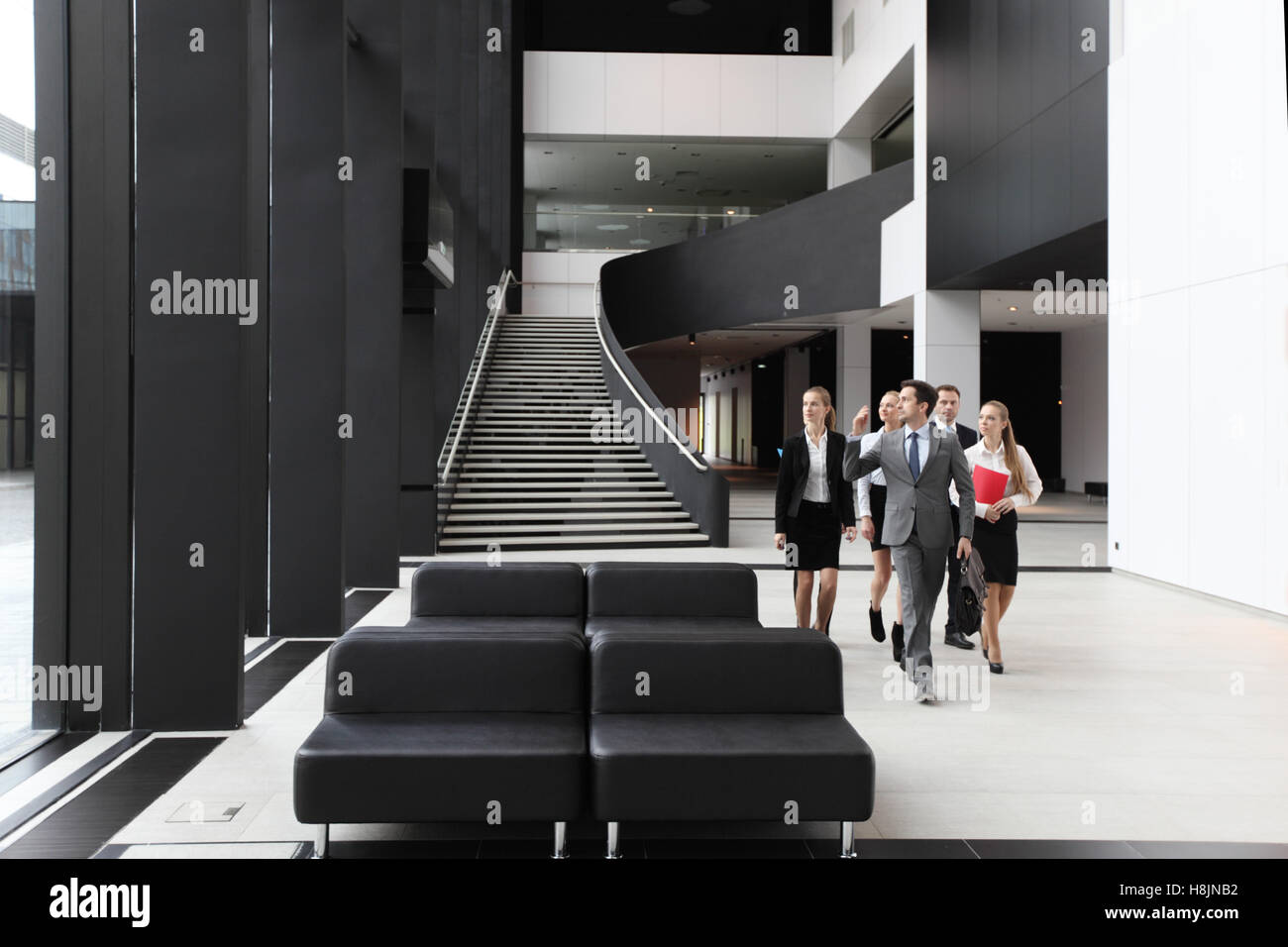 Business people walking lobby hi-res stock photography and images - Alamy