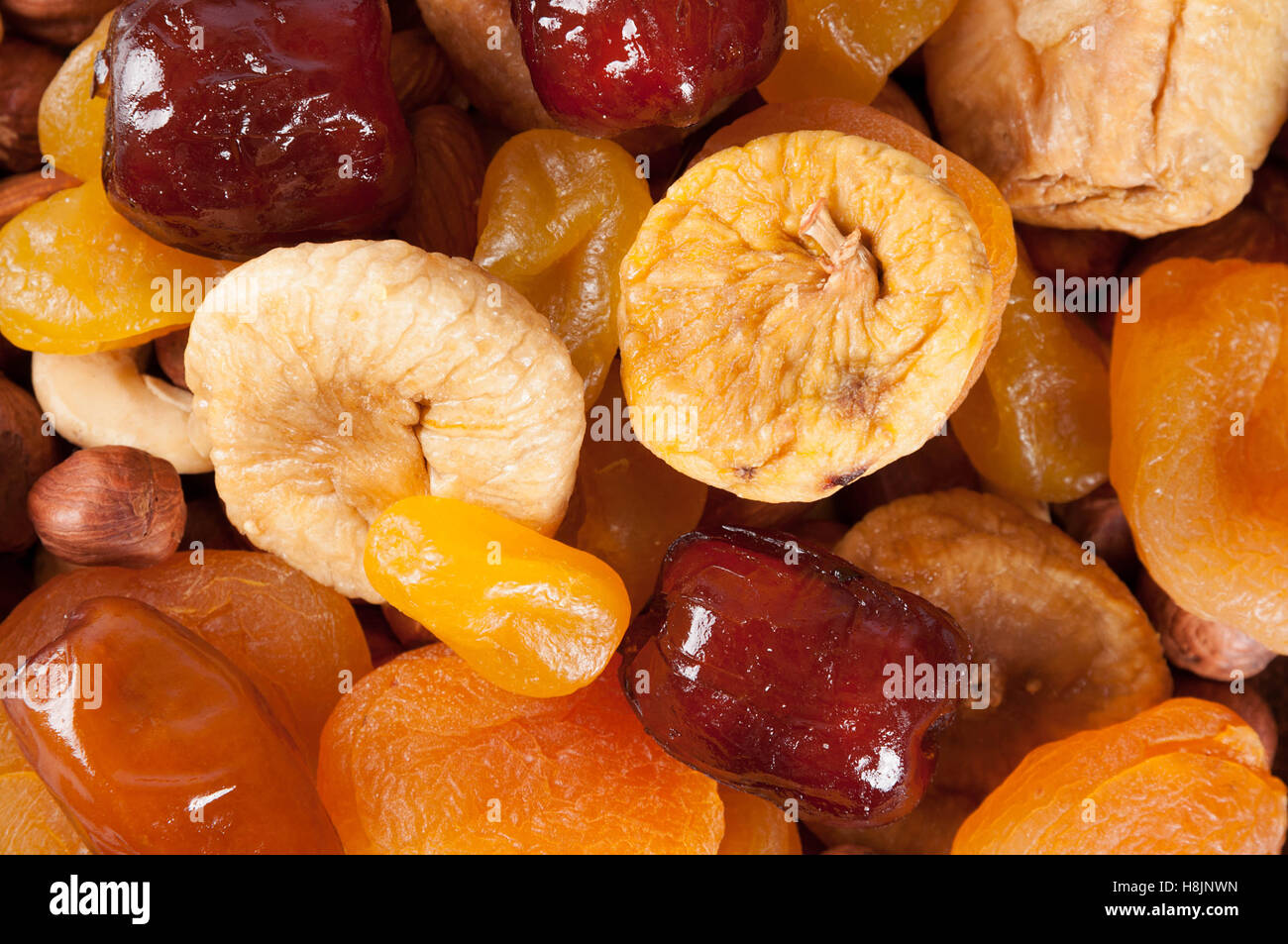 Dried fruits, nuts and dates. Top view. Candied fruits, lemon, apricot