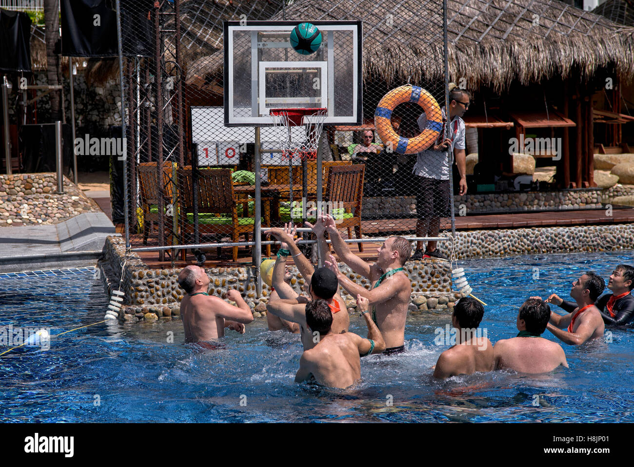 Water polo. Group of male tourists playing water polo at the Hard Rock Hotel, Pattaya Thailand S. E. Asia Stock Photo