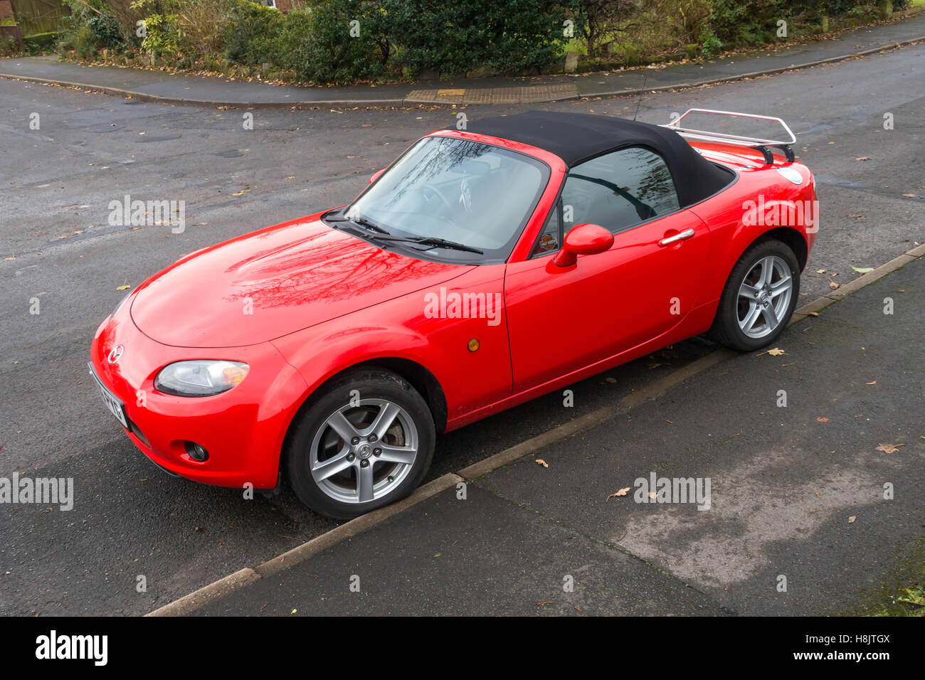 A 2006 red Mazda MX5 sports roadster motor car Stock Photo