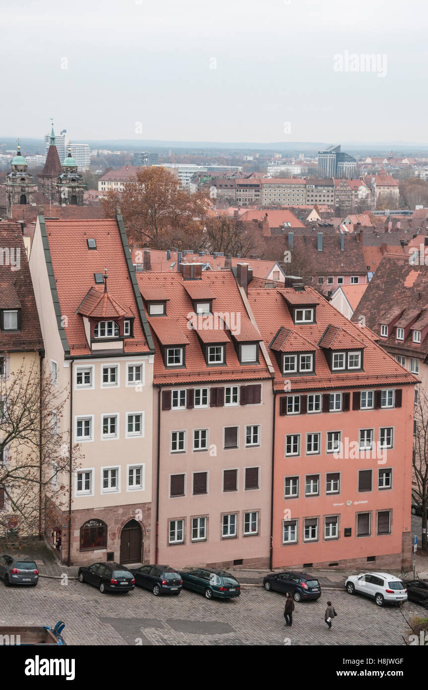 A row of multi-story town homes with steep rooflines and closely packed together in the city of Nuremburg, Germany. Stock Photo