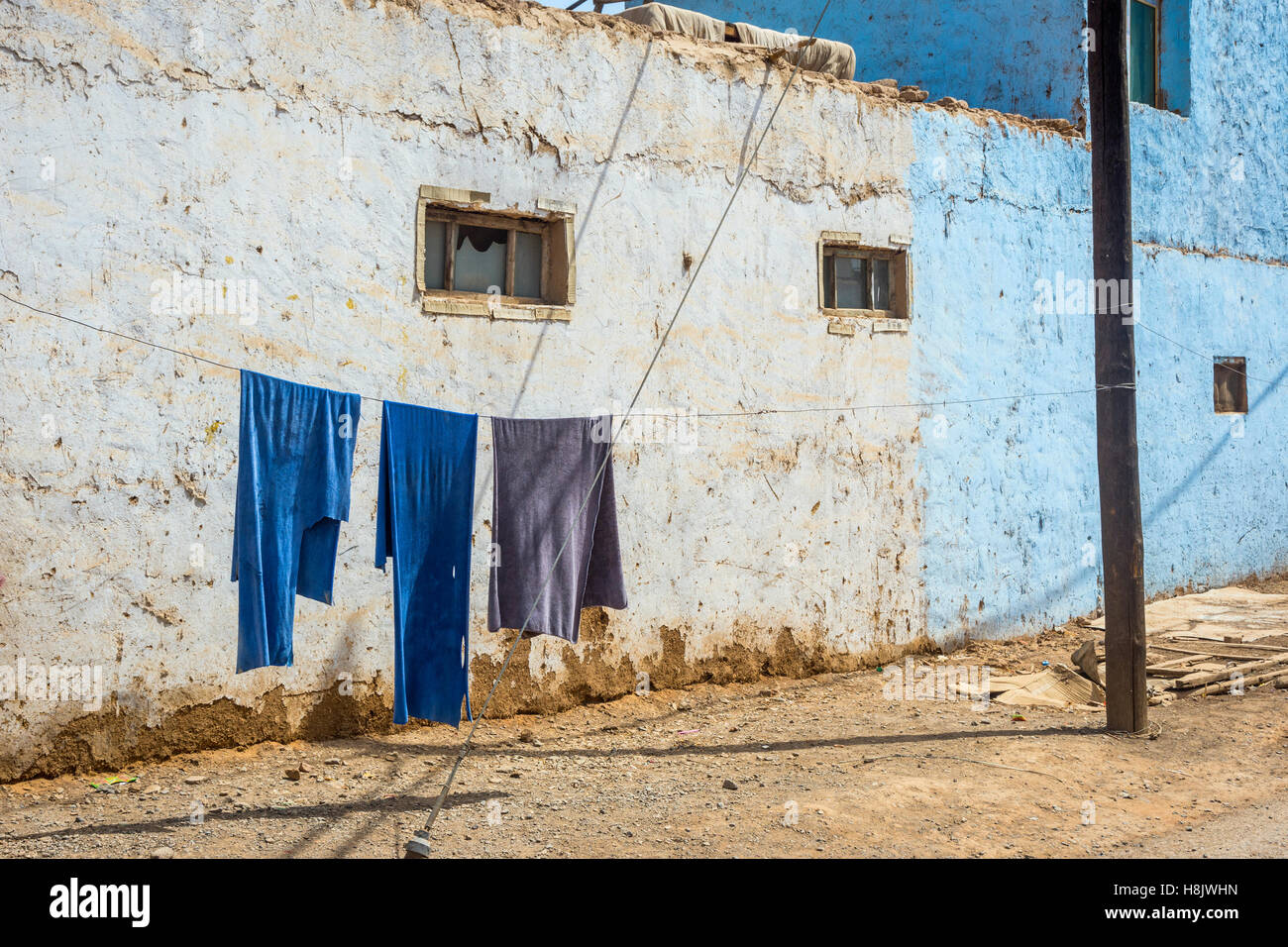 Blue laundry drying outside on the rope, Turpan, Xinjiang China Stock Photo