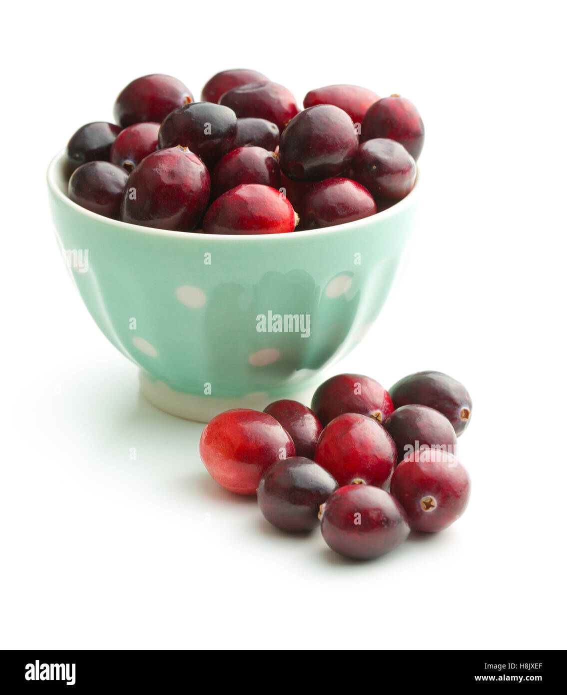 The tasty american cranberries in bowl isolated on white background. Stock Photo