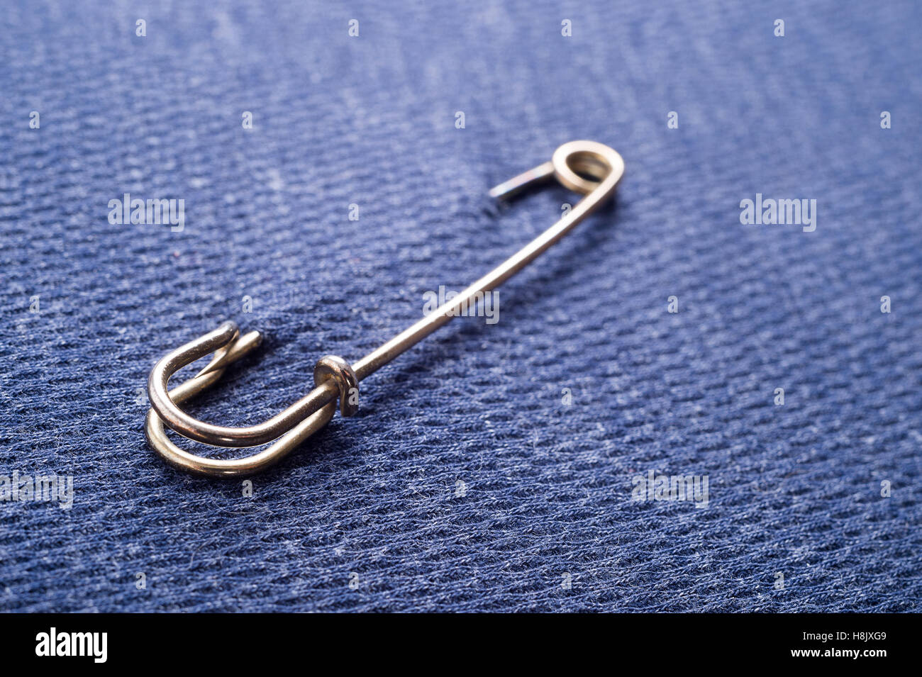 Safety pin on clothes as a symbol of solidarity Stock Photo