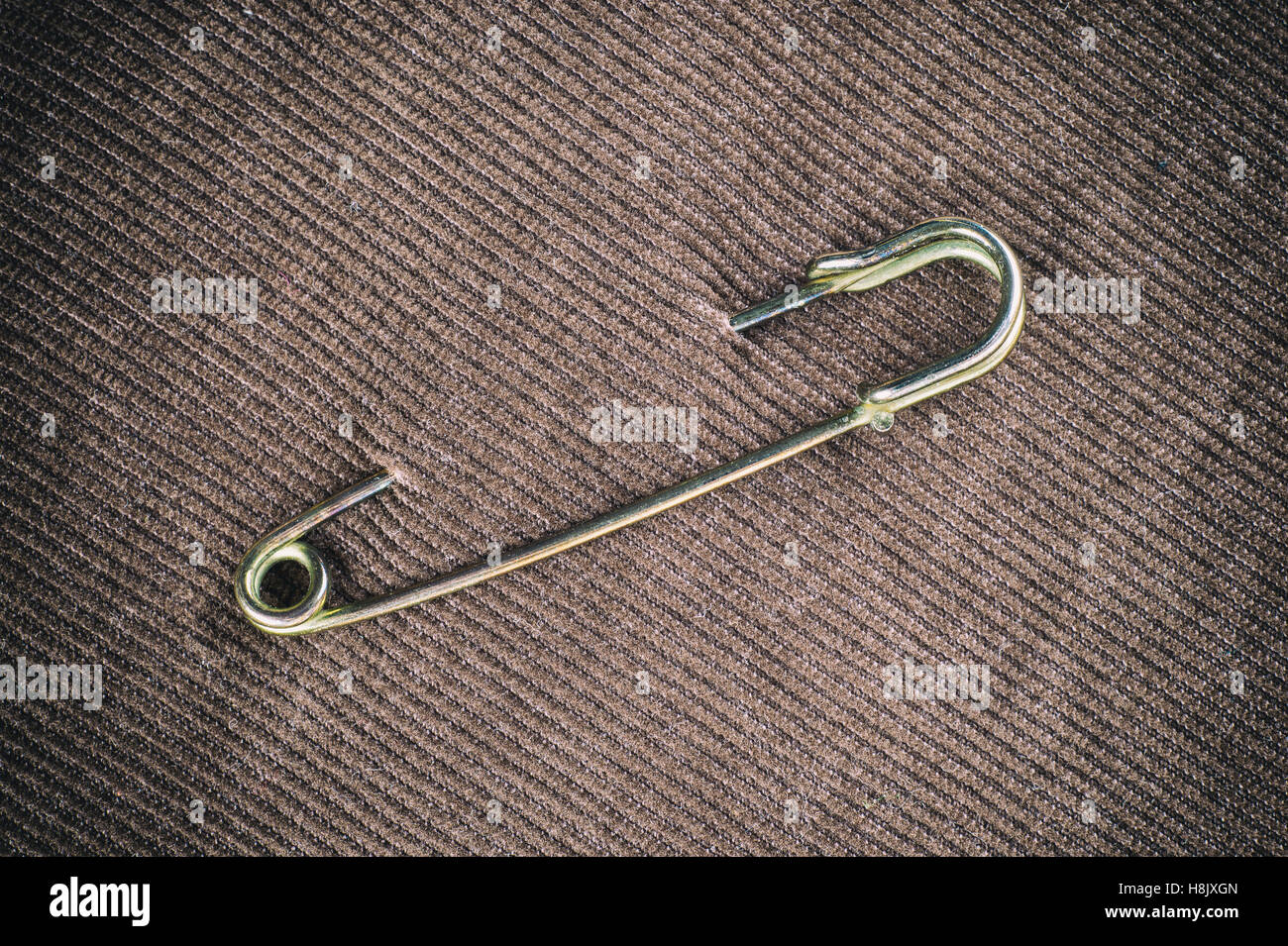 Safety pin on clothes as a symbol of solidarity Stock Photo