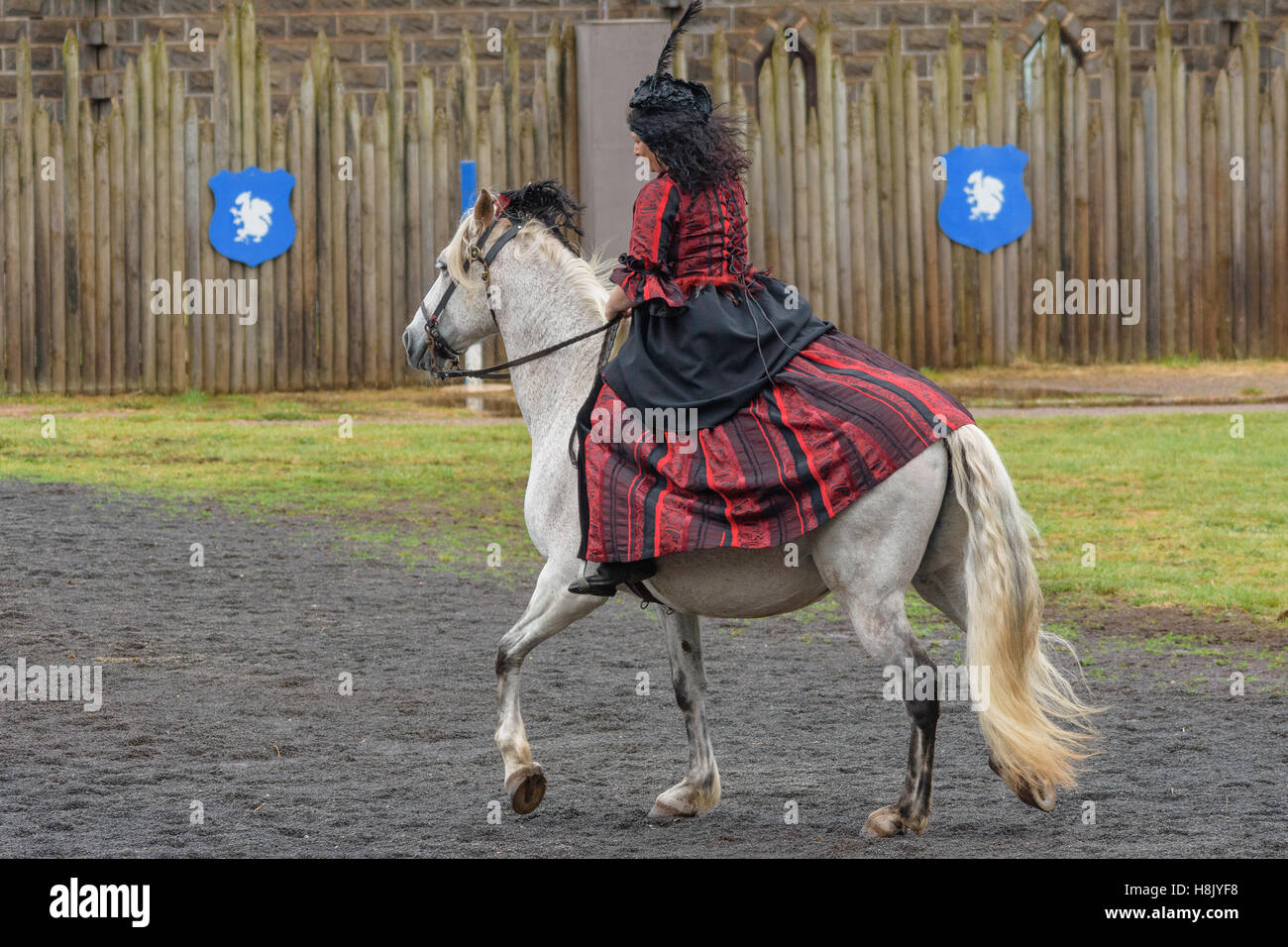Woman in red dress riding horse hi-res stock photography and images - Alamy